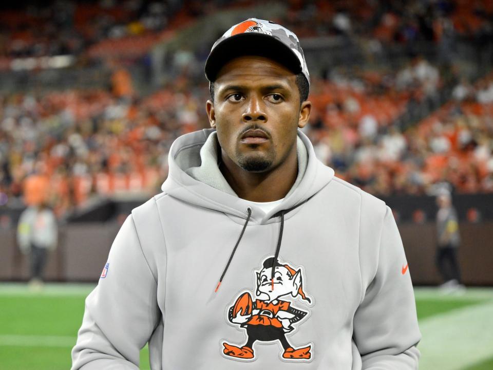 Deshaun Watson looks on from the sidelines of the field during a Browns preseason game.