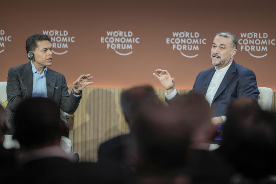Iran's Foreign Minister Hossein Amir-Abdollahian, right, is engaged in discussion with Fareed Zakaria at the Annual Meeting of World Economic Forum in Davos, Switzerland, Wednesday, Jan. 17, 2024. The annual meeting of the World Economic Forum is taking place in Davos from Jan. 15 until Jan. 19, 2024.(AP Photo/Markus Schreiber)