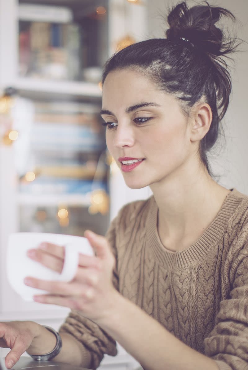 A woman drinking coffee