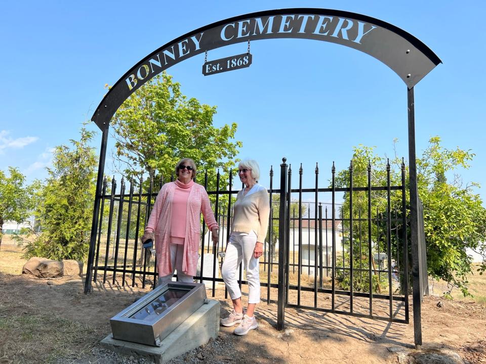 Marilee Westfall, left, and Robin Groshong attend a gathering of Bonney descendants Aug. 25 to rededicate a pioneer cemetery on the grounds of MacLaren Youth Correctional Facility in Woodburn. Westfall and Groshong helped identify who is buried there.