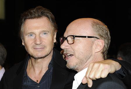 Cast member Liam Neeson and director Paul Haggis (R) pose on the red carpet before a screening of their film "Third Person" at The Visa Screening Room during the 38th Toronto International Film Festival in Toronto September 9, 2013. REUTERS/Jon Blacker