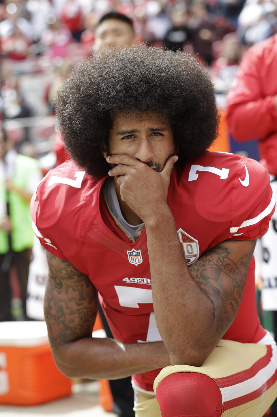 FILE - In this Oct. 2, 2016, file photo, then-San Francisco 49ers quarterback Colin Kaepernick kneels during the national anthem before an NFL football game against the Dallas Cowboys, in Santa Clara, Calif. Because Kaepernick was the first to kneel during the anthem to bring attention to social causes, the NFL has always been at the epicenter of the debate. League policy at the time was murky on whether players were required to stand. (AP Photo/Marcio Jose Sanchez, File)