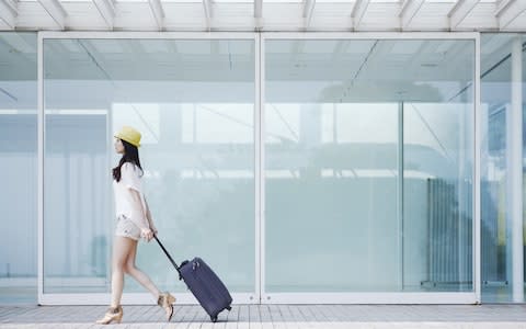 Only those who pay for priority boarding can travel with their hand luggage - Credit: GETTY