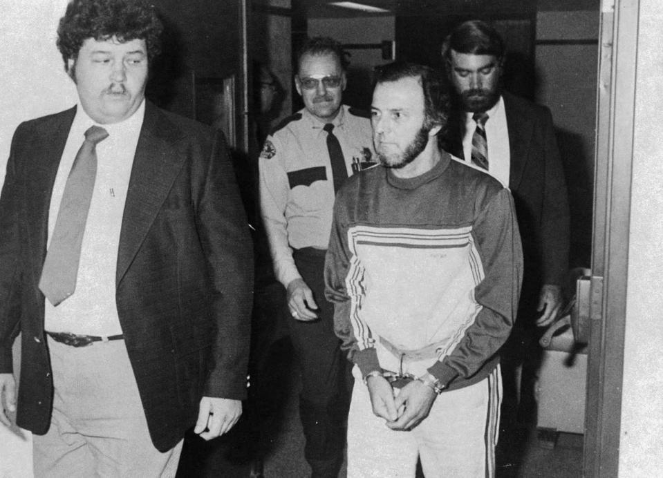 Caesar Montevecchio, then 49, is escorted to the Erie County District Attorney's Office on Aug. 25, 1983, ahead of his preliminary hearing that day on charges related to he contract killing of Erie bookmaker Frank "Bolo" Dovishaw in January 1983.