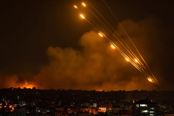 Rockets are fired toward Israel from the Gaza Strip, Oct. 8, 2023. <span class="copyright">Fatima Shbair—AP</span>