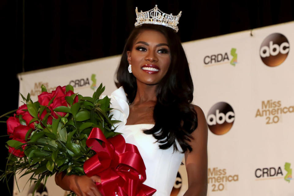 Franklin smiling after being crowned and holding roses