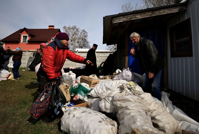 The Wider Image: Behind enemy lines, Ukrainian woman survives with her chickens