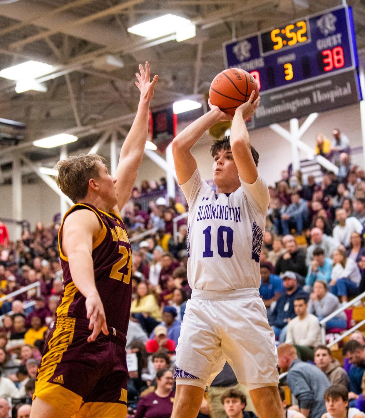 South's Aiden Schmitz (10) shoots over North's Gavin Reed (23) during the Bloomington North versus Bloomington South boys basketball game at Bloomington High School South on Friday, Jan. 6, 2023.