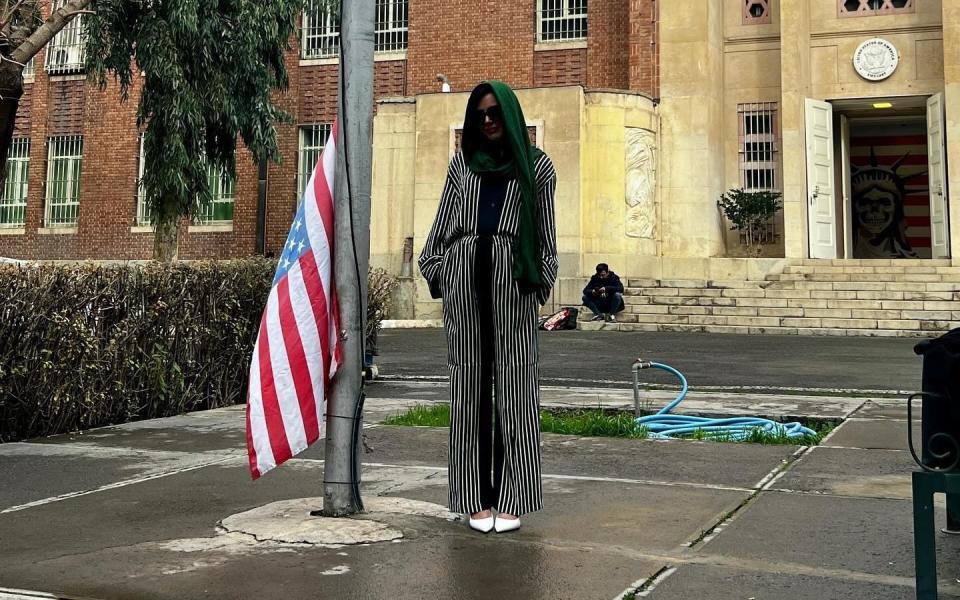 Whitney Wright, a US porn star, stands outside the entrance to the former US Embassy in Tehran