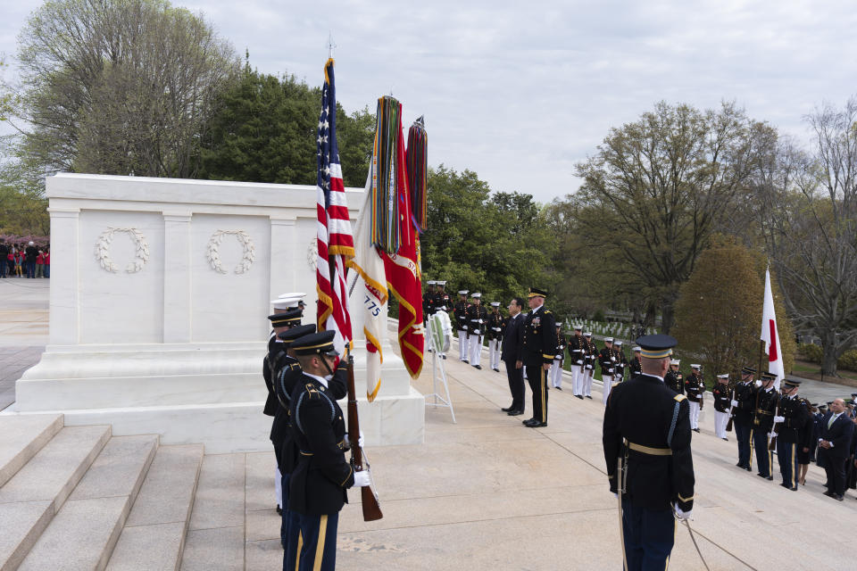 Japan's Prime Minister Fumio Kishida, with Commanding General Military District of Washington Maj. Gen. Trevor Bredenkamp, right, lays a wreath at the Tomb of the Unknown Soldier, at Arlington National Cemetery, in Arlington, Va., Tuesday, April 9, 2024. (AP Photo/Manuel Balce Ceneta)