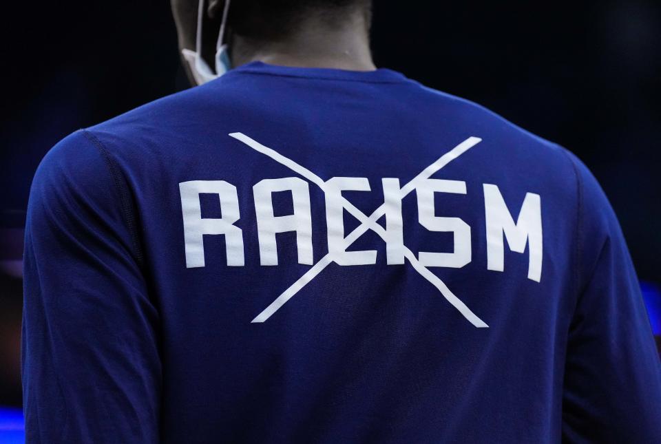 racism  Mar 27, 2022; Philadelphia, PA, USA; St. Peters Peacocks player wears a Black Lives Matter t-shirt before the finals of the East regional of the men's college basketball NCAA Tournament against the North Carolina Tar Heels at Wells Fargo Center. Mandatory Credit: Mitchell Leff-USA TODAY Sports