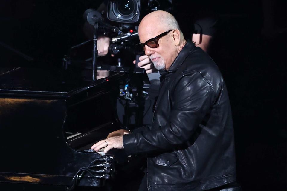 <p>Amy Sussman/Getty Images</p> Billy Joel performs at the 2024 Grammys