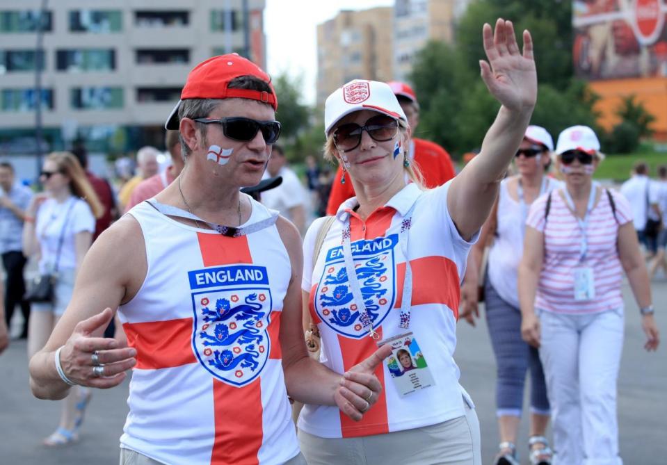 Heading through the group: England fans prepare for the game (PA)