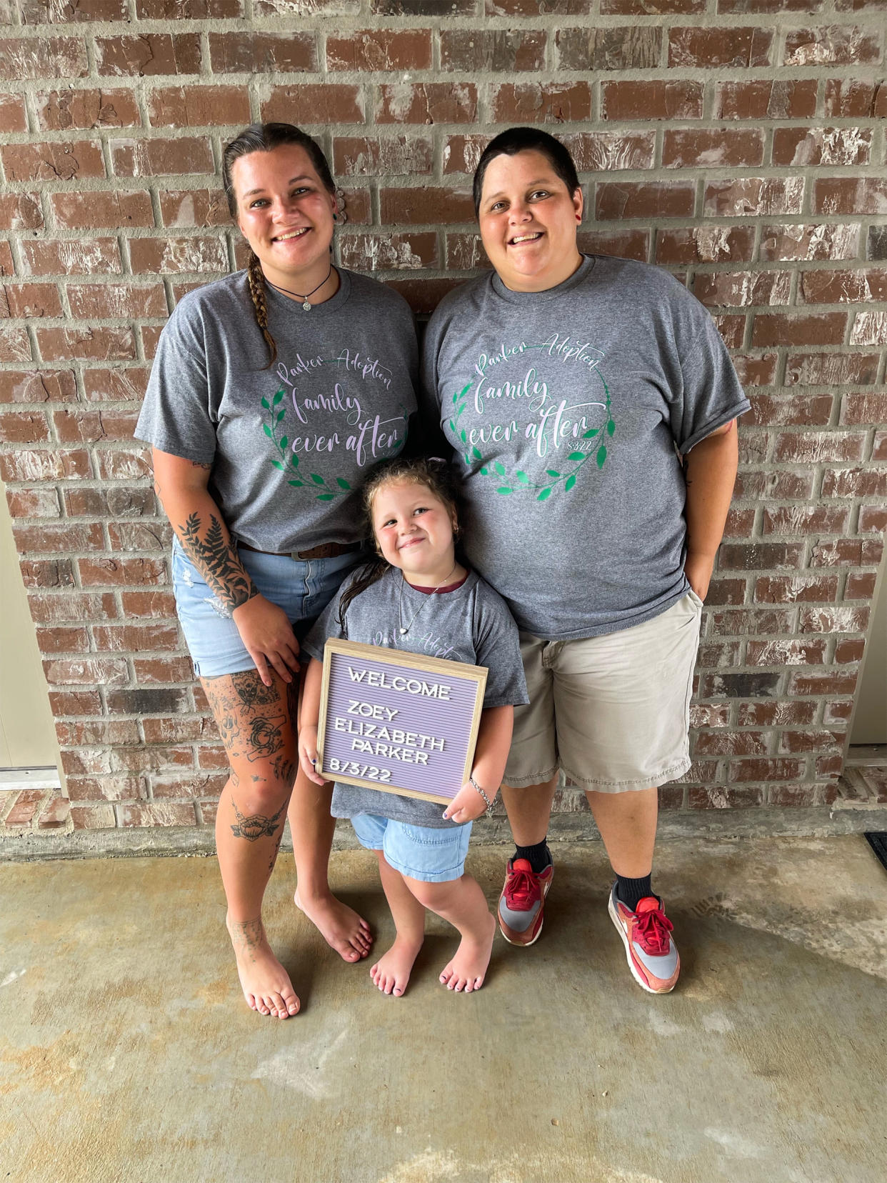 Emily and Jennifer Parker, right, with their daughter Zoey on Aug. 3, 2022, the day they adopted her. (Courtesy Jennifer Parker)