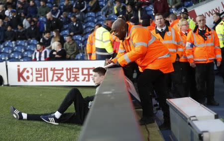 Britain Football Soccer - West Bromwich Albion v Stoke City - Premier League - The Hawthorns - 4/2/17 West Brom ballboy has his name taken by stewards after the game after refusing to give the ball back to the Stoke City goalkeeper Action Images via Reuters / Carl Recine Livepic