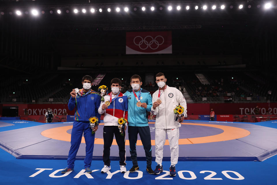 CHIBA, JAPAN - AUGUST 05: Men's Freestyle 57kg medalists (L-R); silver medalist Kumar Ravi of Team India, gold medalist Zavur Uguev of Team ROC, bronze medalist Nurislam Sanayev of Team Kazakhstan and second bronze medalist Thomas Patrick Gilman pose with their medals during the Victory Ceremony on day thirteen of the Tokyo 2020 Olympic Games at Makuhari Messe Hall on August 05, 2021 in Chiba, Japan. (Photo by Maddie Meyer/Getty Images)