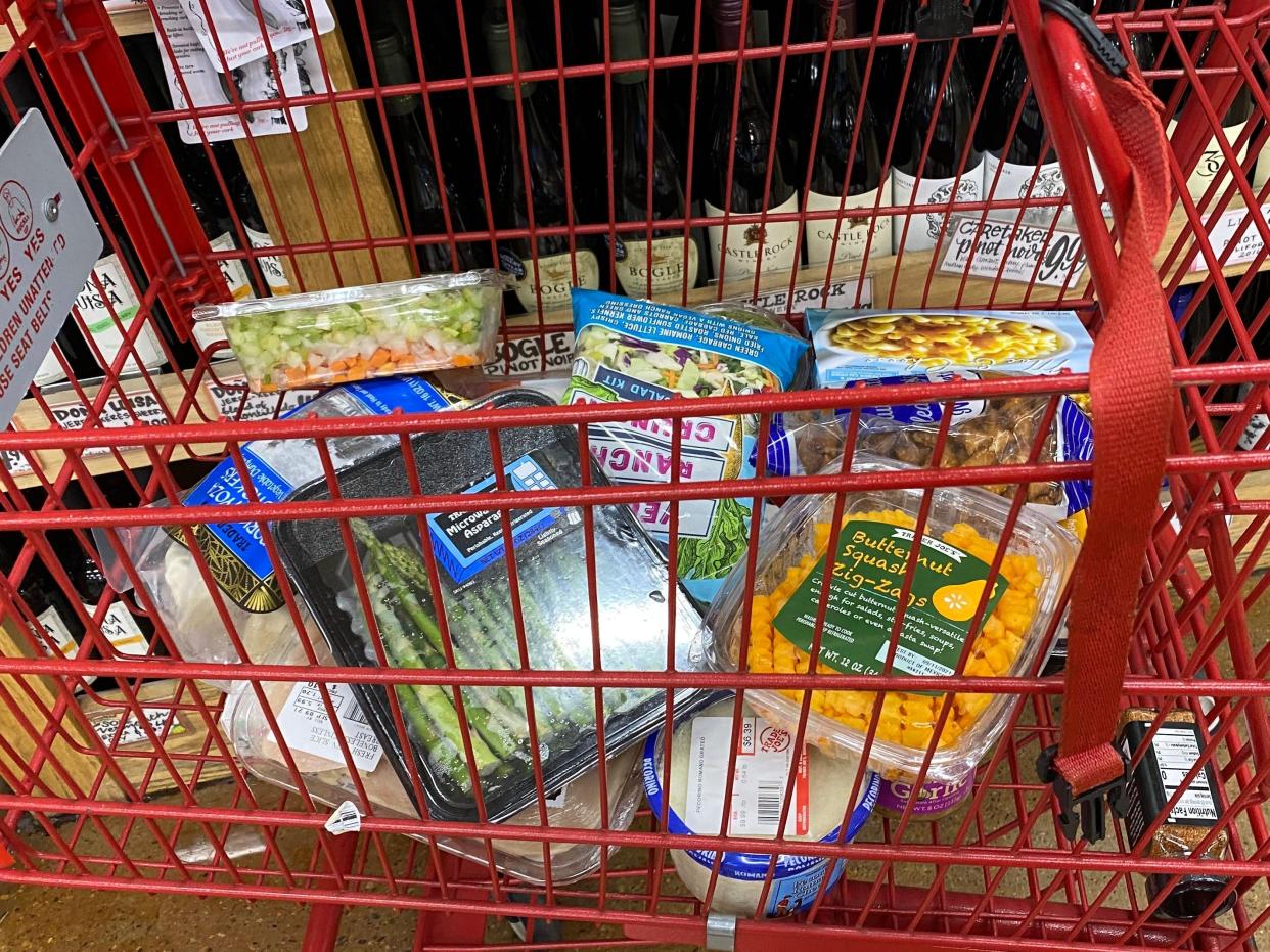 Trader Joe's red cart full of different foods