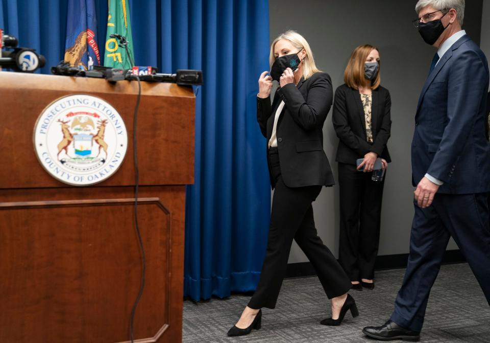 Oakland County Prosecutor Karen McDonald approaches the microphone to announce charges against 15-year-old Ethan Crumbley on Dec. 1, 2021, from her office. The charges are related to a mass shooting incident that took place at Oxford High School on Tuesday, Nov. 30, 2021.