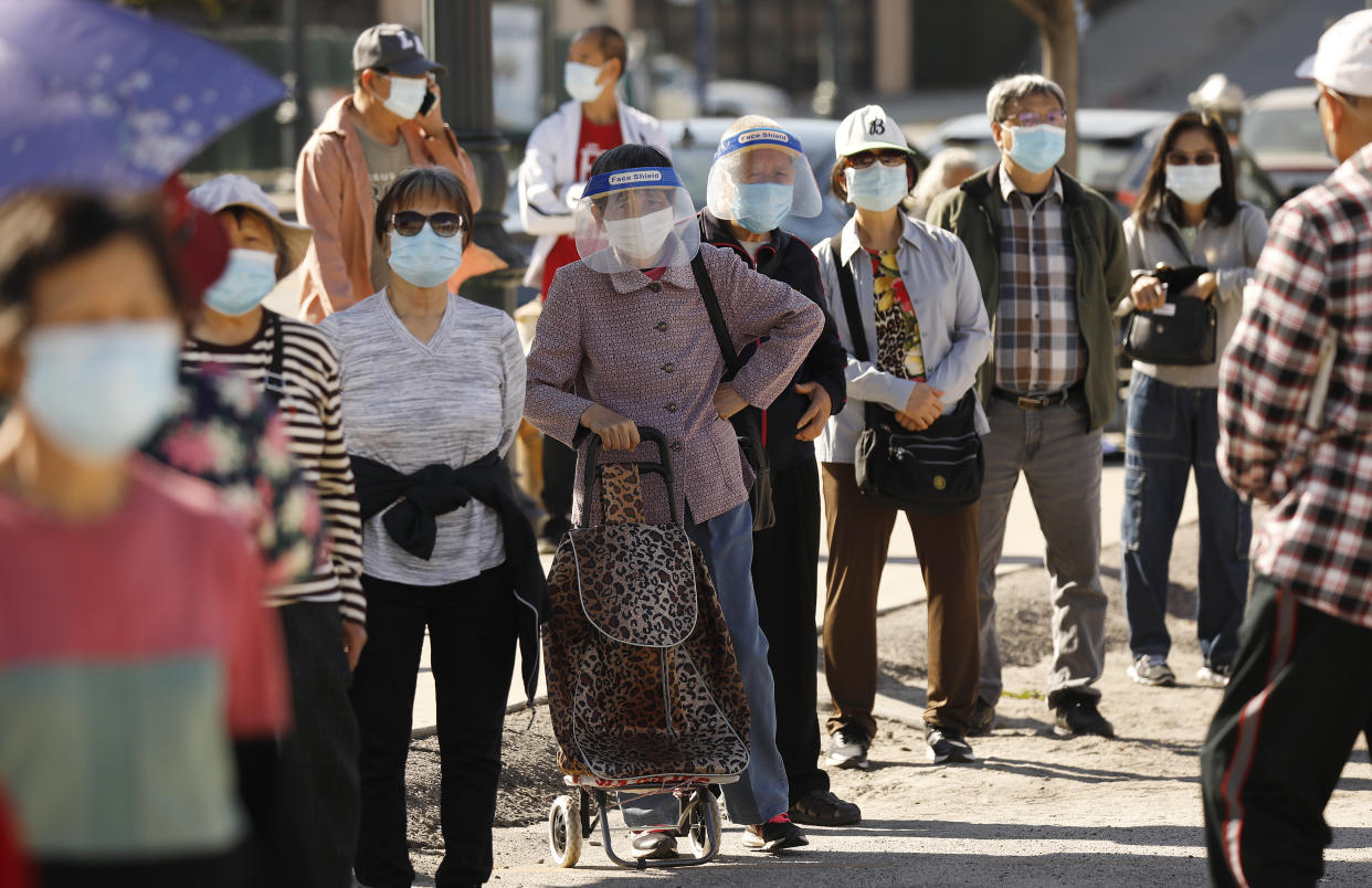 People with appointments line up at a vaccination clinic in Chinatown for senior citizens on Feb. 24, 2021 in Los Angeles, CA. (Al Seib/Los Angeles Times via Getty Images).