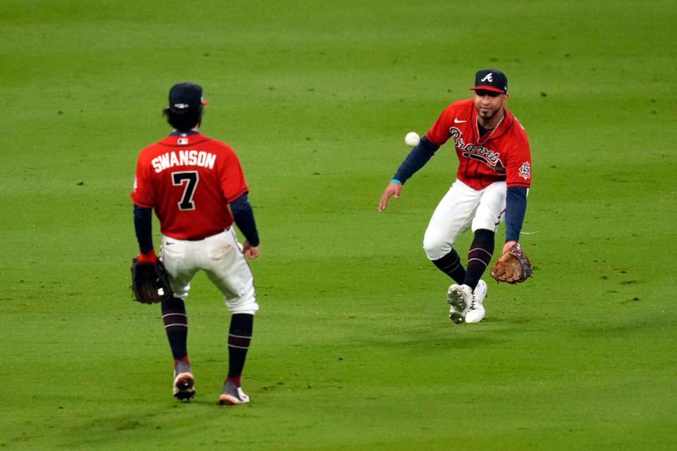 Braves left fielder Eddie Rosario can't catch a fly ball hit by Aledmys Diaz in the eighth inning