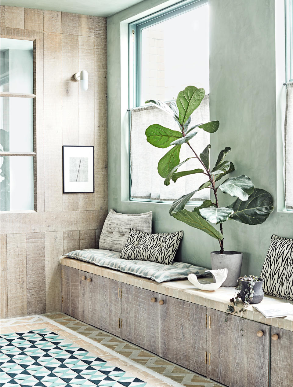 <p> 'If you have gone for a pale paint color in a hallway, it's important to work in texture, whether via natural materials or pattern in upholstery,' says <em>Homes & Gardens</em>' Editor in Chief Lucy Searle. </p> <p> Paneling for walls is one way to do this; aesthetically pleasing, practical and space-enhancing, paneling can be a real bonus in a hallway. We love how the material used here has been continued into the storage, while providing seating in what would usually be a thoroughfare given little pause for thought. </p>