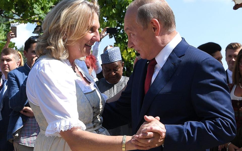 Austria's Foreign Minister Kneissl dances with Russia's President Putin at her wedding in Gamlitz  - REUTERS