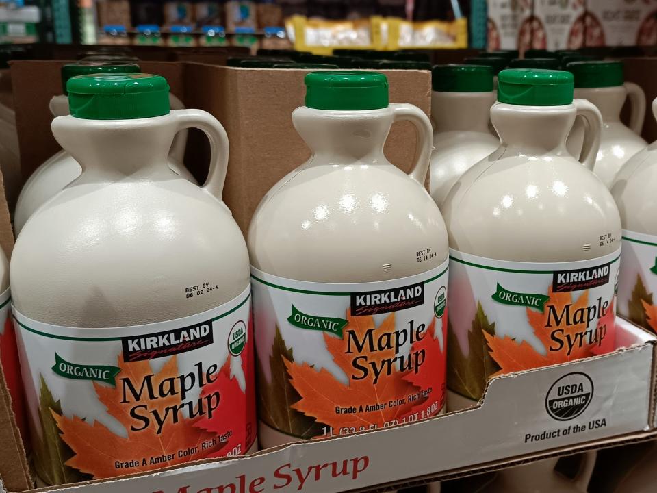 Line of Jugs of Kirkland maple syrup at Costco