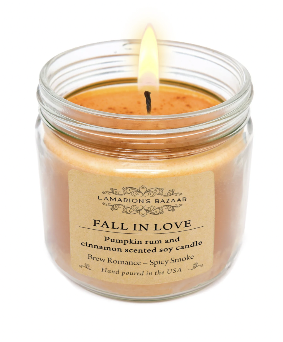 <p><a href="https://lamarionsbazaar.com/products/fall-in-love-pumpkin-rum-and-cinnamon-scented-soy-candle?variant=31950946369634¤cy=USD&gclid=Cj0KCQjwz96WBhC8ARIsAATR253hxPkTfBKTHjsNfWMUCvKjREwrTZVE4OfUW5kcpC6xGKu4L35mW6gaAg0AEALw_wcB" rel="nofollow noopener" target="_blank" data-ylk="slk:Shop Now;elm:context_link;itc:0;sec:content-canvas" class="link ">Shop Now</a></p><p>"Fall in Love" Soy Candle</p><p>lamarionsbazaar.com</p><p>$16.00</p><span class="copyright">Lamarion's Bazaar</span>