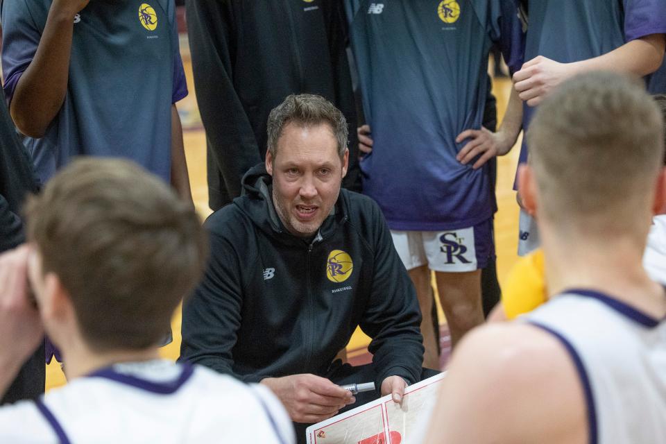 St Rose Coach Brian Lynch coaches his team during break in second half action. St Rose Boys Basketball defeats Red Bank Regional 47-26 in BUC Basketball Classic in Red Bank NJ on December 30, 2022. 