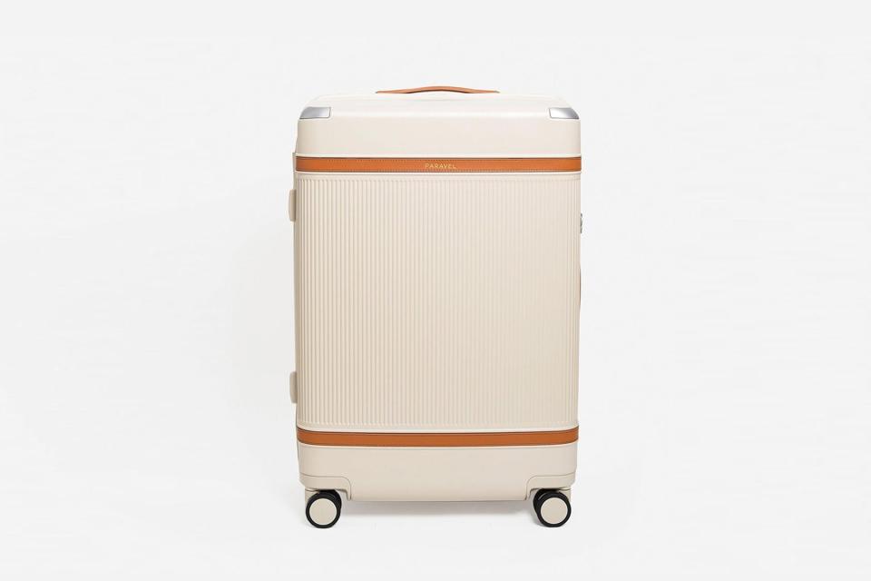 Cream and brown hardside suitcase