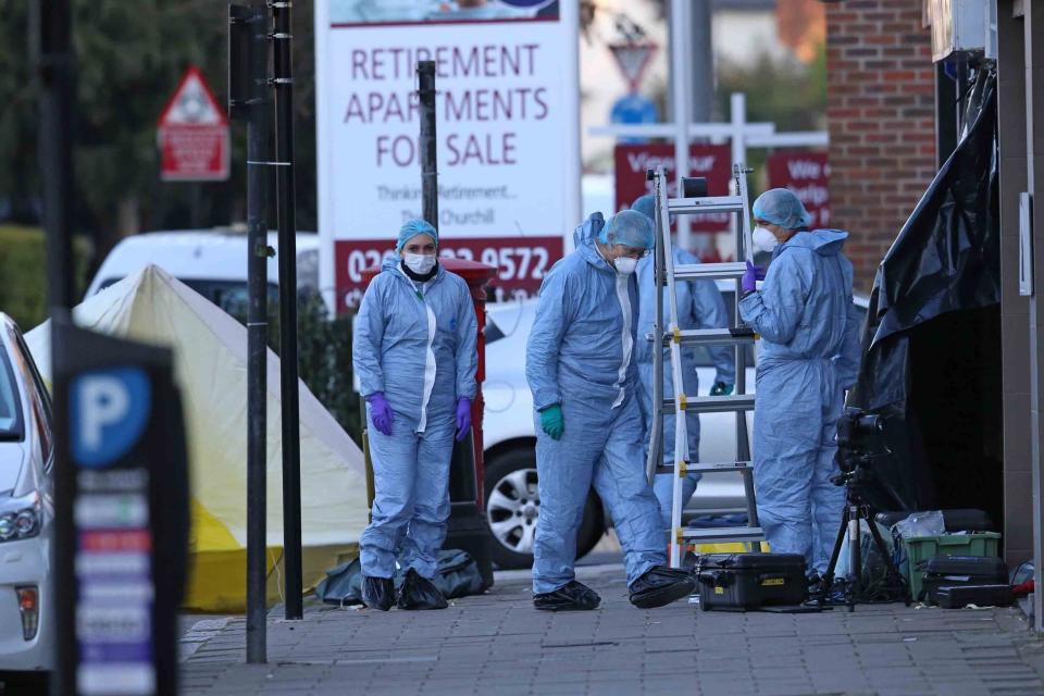 Forensic investigators at the scene in Pinner where a shopkeeper was fatally stabbed (NIGEL HOWARD ©)