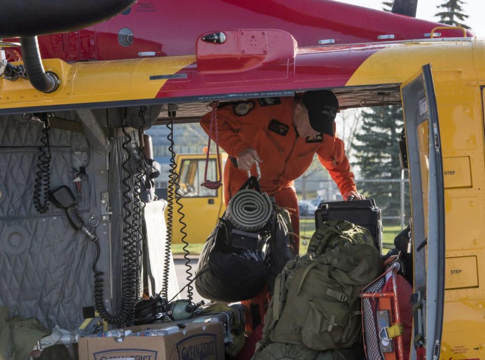 Members of 417 Combat Support Squadron prepare to depart for Fort McMurray as part of Operation LENTUS, 4 Wing Cold Lake, Alta., on Wednesday, May 4, 2016. THE CANADIAN PRESS/HO-DND, Cpl. Manuela Berger