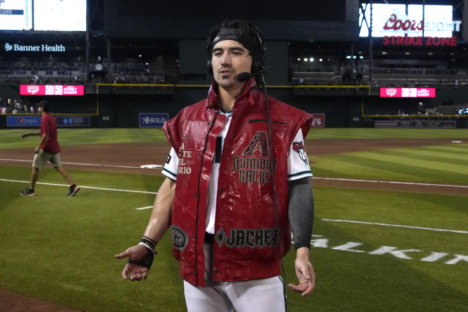 Arizona Diamondbacks' Corbin Carroll wears the "victory vest" after hitting a walkoff RBI single against the Pittsburgh Pirates in the 10th inning during a baseball game, Saturday, July 8, 2023, in Phoenix. (AP Photo/Rick Scuteri)