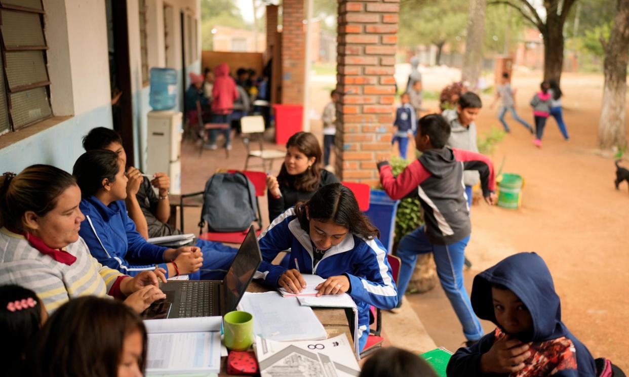 <span>Eighth graders take notes during a geography class at the Nueva Asunción public school in Chaco-i, Paraguay, last month.</span><span>Photograph: Jorge Sáenz/AP</span>