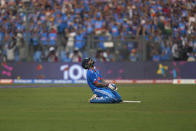 India's Virat Kohli celebrates after scoring a century during the ICC Men's Cricket World Cup first semifinal match between India and New Zealand in Mumbai, India, Wednesday, Nov. 15, 2023. (AP Photo/Rafiq Maqbool)