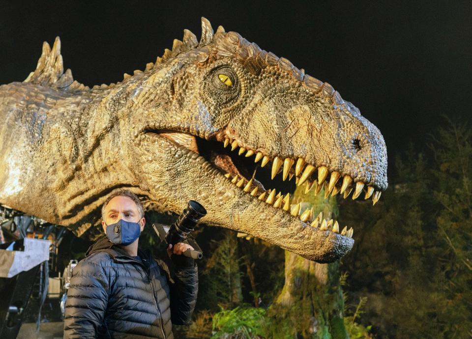 Director Colin Trevorrow on set with an animatronic dinosaur