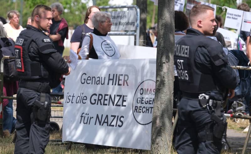 Members of Grandmas Against The Right at a rally outside the national party conference of the far-right Alternative for Germany (AfD) party in July. They hold a banner saying 