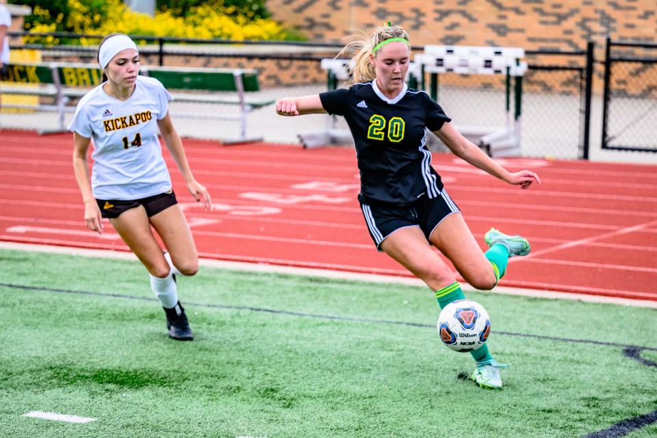 Rock Bridge's Madison Hendershott (20) shoots from the corner to center the ball during the Bruins' 3-1 win over Kickapoo in the MSHSAA state sectionals on May 28.