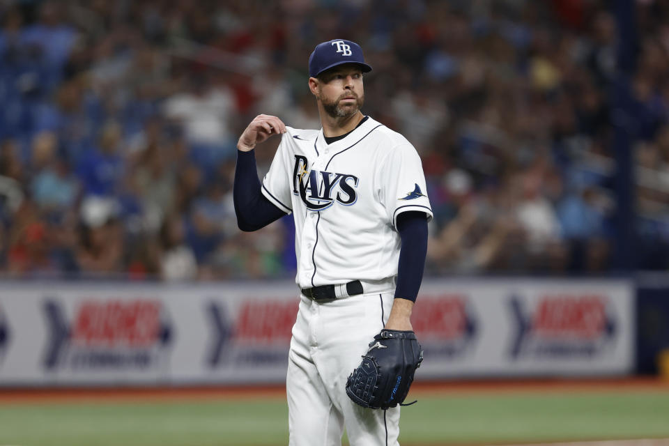 Tampa Bay Rays starting pitcher Corey Kluber waits for a new ball after giving up a home run to the Boston Red Sox during the third inning of a baseball game Friday, April, 22, 2022, in St. Petersburg, Fla. (AP Photo/Scott Audette)