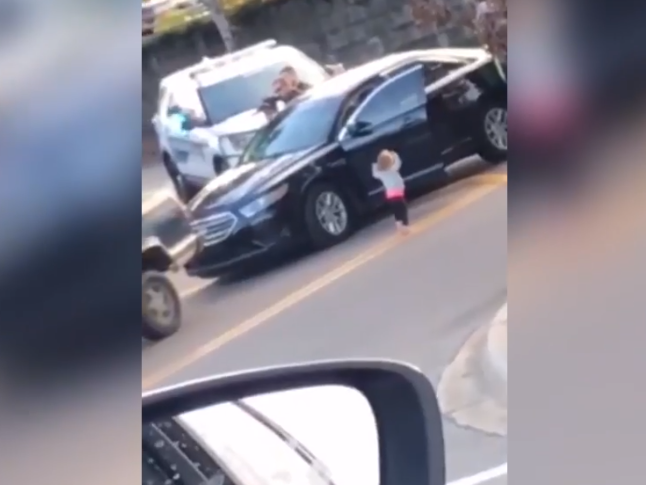 Barefoot two-year-old girl walks towards armed police with hands up during dad’s arrest