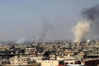 Smoke rises from the old city during a battle against Islamic State militants, in Mosul, Iraq, March 26, 2017. REUTERS/Youssef Boudlal