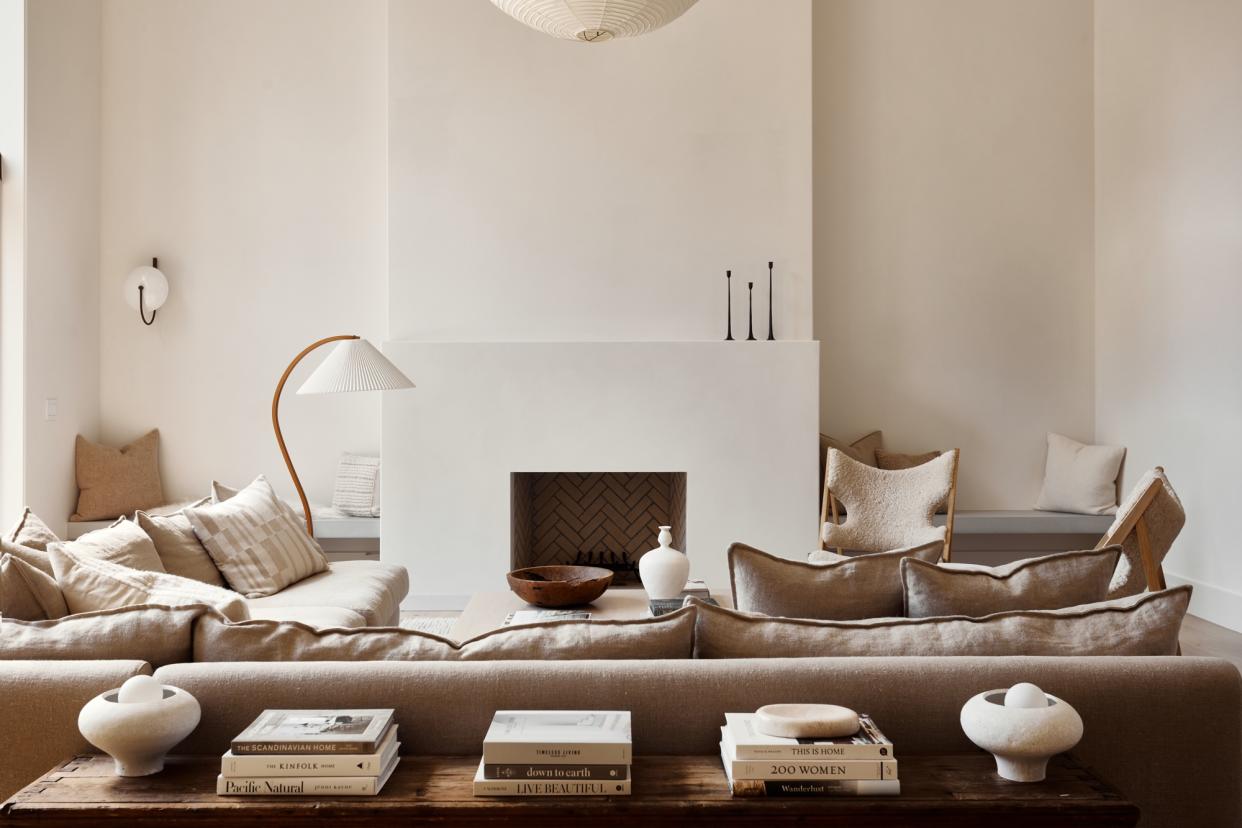  what couch color makes a room look bigger; grey linen sofa in grey living room by Lisa Staton Design 