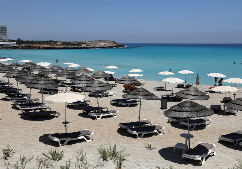 Empty sunbeds are seen at Nissi Beach in the resort of Ayia Napa