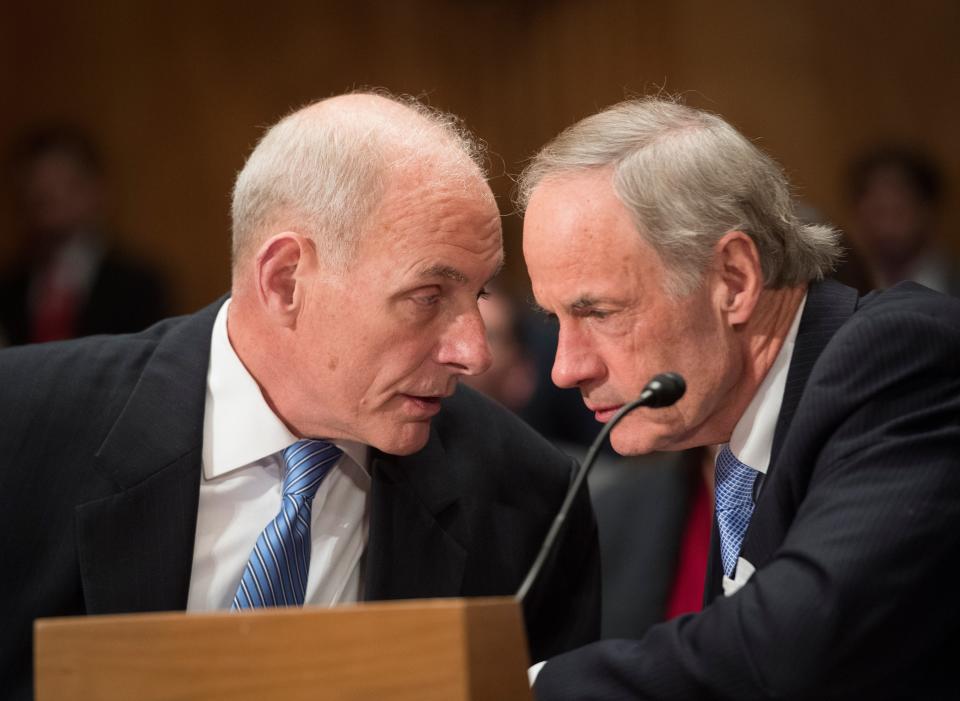 Senator Tom Carper, D-Delaware, right, speaks with John F. Kelly, nominee for Secretary of Homeland Security, before confirmation hearing before the Senate Homeland Security and Governmental Affairs Committee.