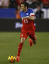 U.S. defenseman Michael Parkhurst (15) carries the ball against Mexico during the second half of an international friendly soccer match Wednesday, April 2, 2014, in Glendale, Ariz. The game ended in a 2-2 draw. (AP Photo/Rock Scuteri)