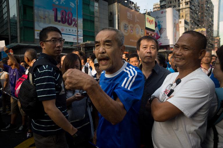 A government loyalist shouts at pro-democracy protesters in Mongkok, Hong Kong, on October 3, 2014