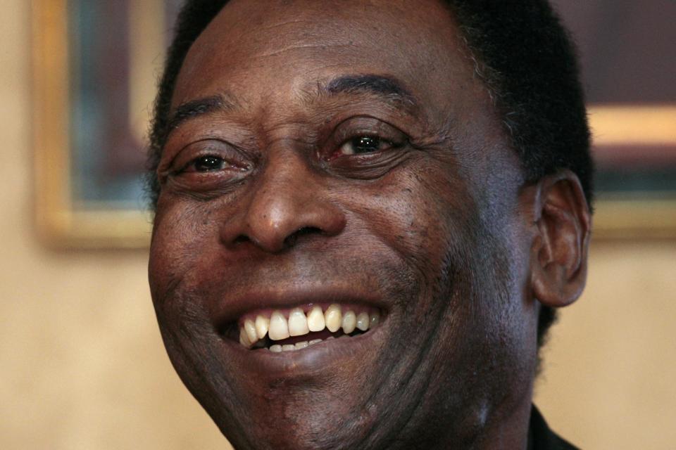 Brazilian soccer legend Pele smiles during a news conference in Hong Kong in this March 7, 2011 file photo. The football great, who is in a Sao Paulo hospital for treatment for a urinary tract infection, has been moved to a hospital wing where he won't be besieged by as many visitors, his spokesman told Reuters on November 27, 2014. REUTERS/Tyrone Siu/Files (CHINA - Tags: SPORT SOCCER HEADSHOT)