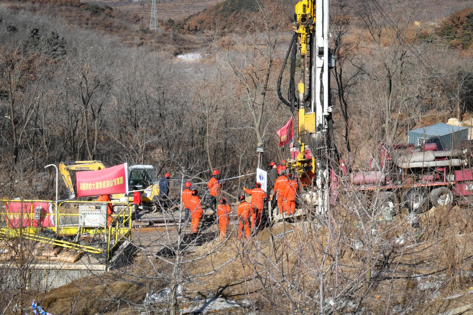 Members of a rescue team work at the site of a gold mine explosion where 22 miners are trapped underground in Qixia, in eastern China's Shandong province on January 18, 2021. / Credit: AFP/Getty