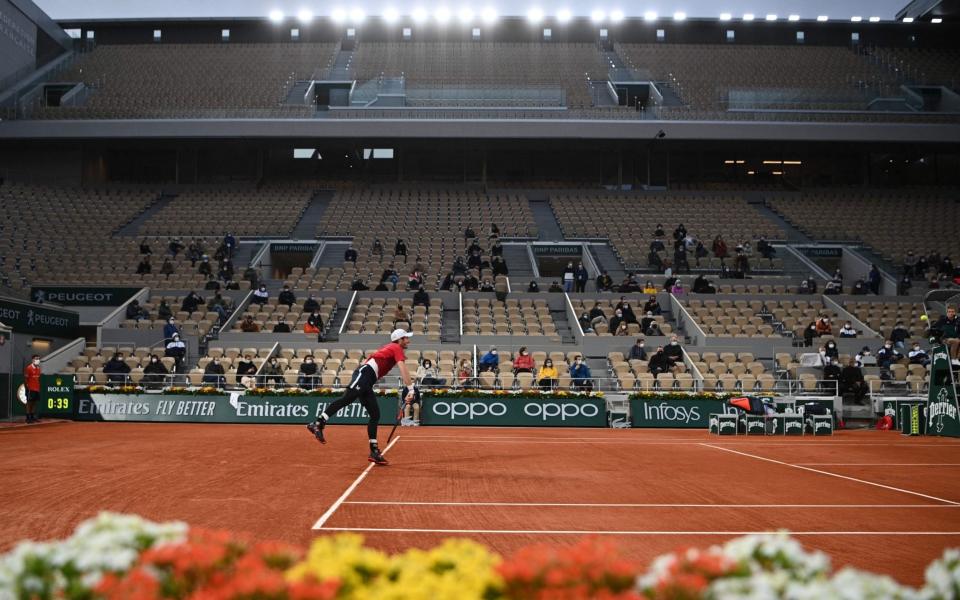 Andy Murray serves during his clash with Stan Wawrinka - Getty Images