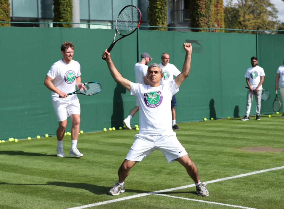 Mayor of London Sadiq Khan plays tennis with key workers at the All England Lawn Tennis Club in Wimbledon, south west London, during an event to thank members of the NHS, TfL and care workers for their service during the coronavirus pandemic.